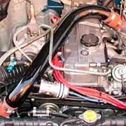 Over the valve cover pipes with Compressor Bypass and Blow-Off valves Over the valve cover pipes with Compressor Bypass and Blow-Off valves